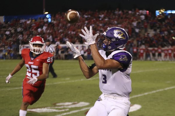 Lemoore's Brandon Hargrove has his eyes on another Justin Holaday pass Friday night in the Tigers 49-41 loss to Sanger High School.